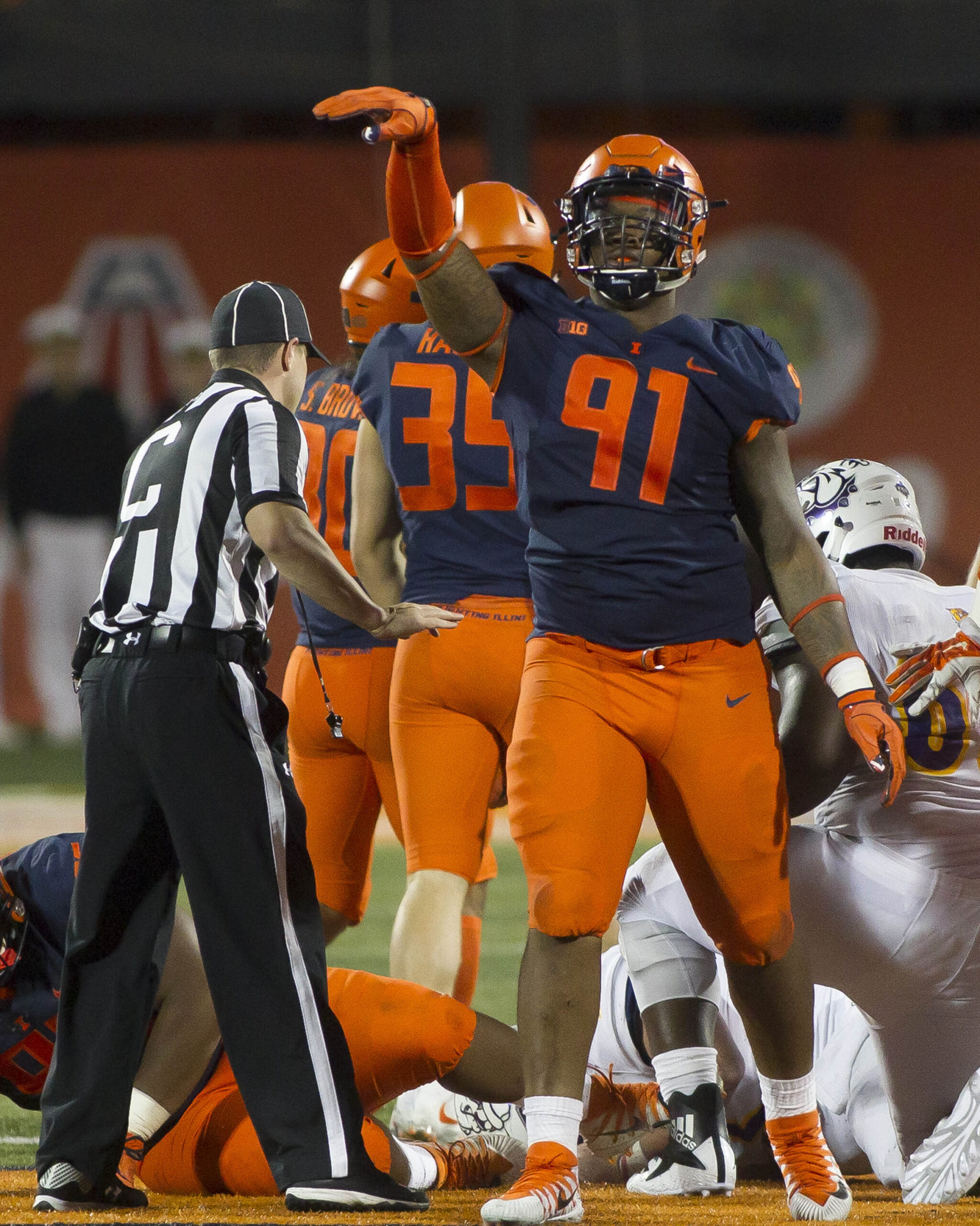 Sep 8, 2018; Champaign, IL, USA; Illinois Fighting Illini defensive lineman Jamal Woods (91) celebrates after sacking Western Illinois Leathernecks quarterback Sean McGuire (18) during the fourth quarter at Memorial Stadium. Mandatory Credit: Mike Granse-USA TODAY Sports