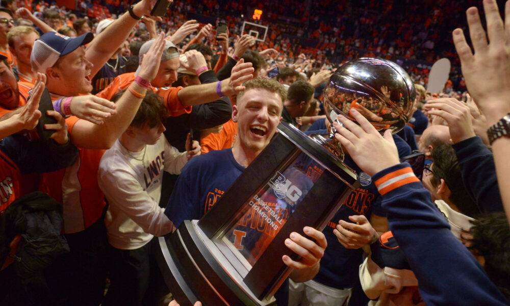 Former Illinois Basketball Guard, Brandin Podziemski, holding the Big Ten Championship trophy