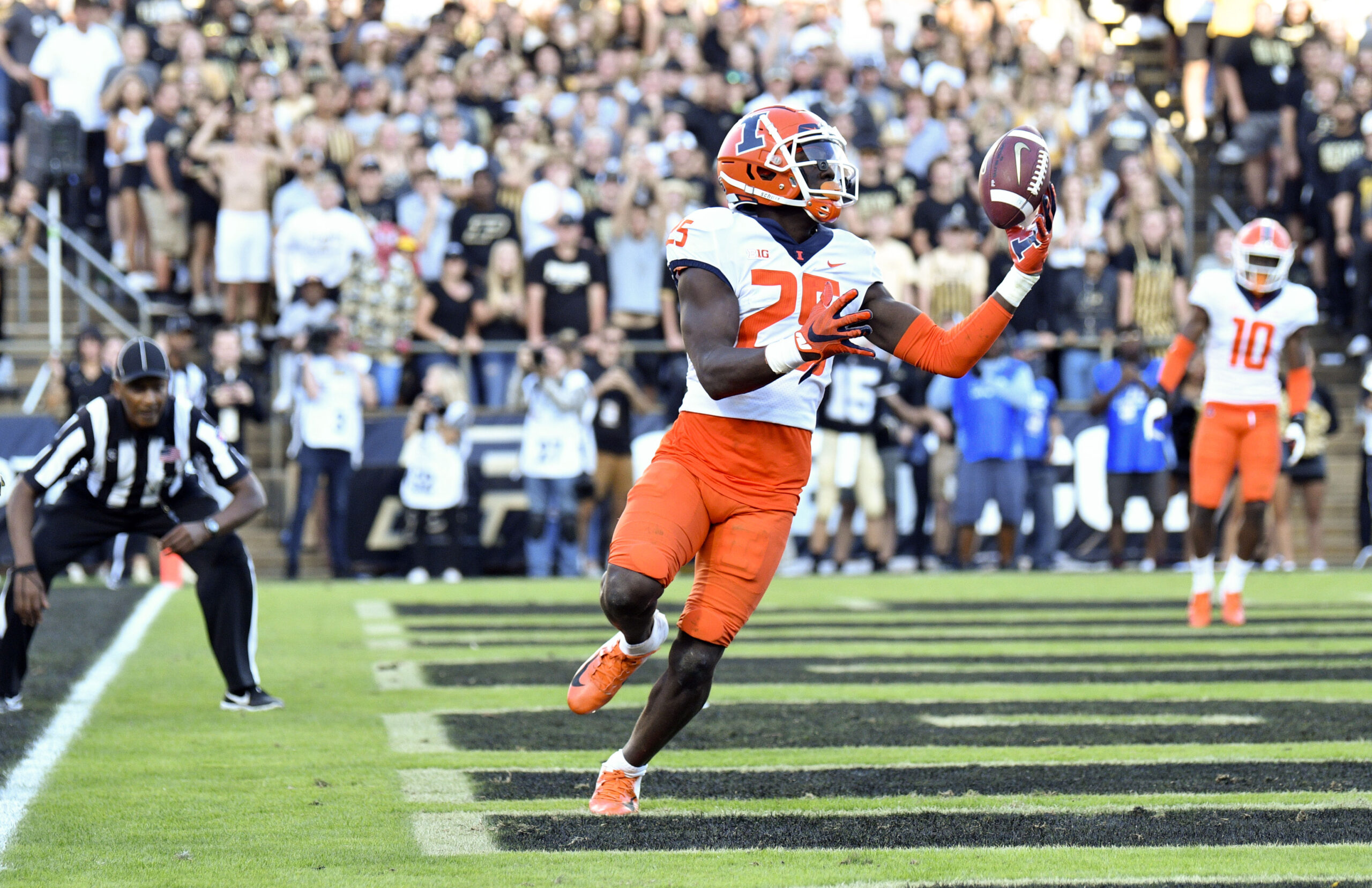 Sep 25, 2021; West Lafayette, Indiana, USA; Illinois Fighting Illini defensive back Kerby Joseph (25) makes an interception in the end zone during the second half against the Purdue Boilermakers at Ross-Ade Stadium. Purdue Wins 13-9. Mandatory Credit: Marc Lebryk-USA TODAY Sports