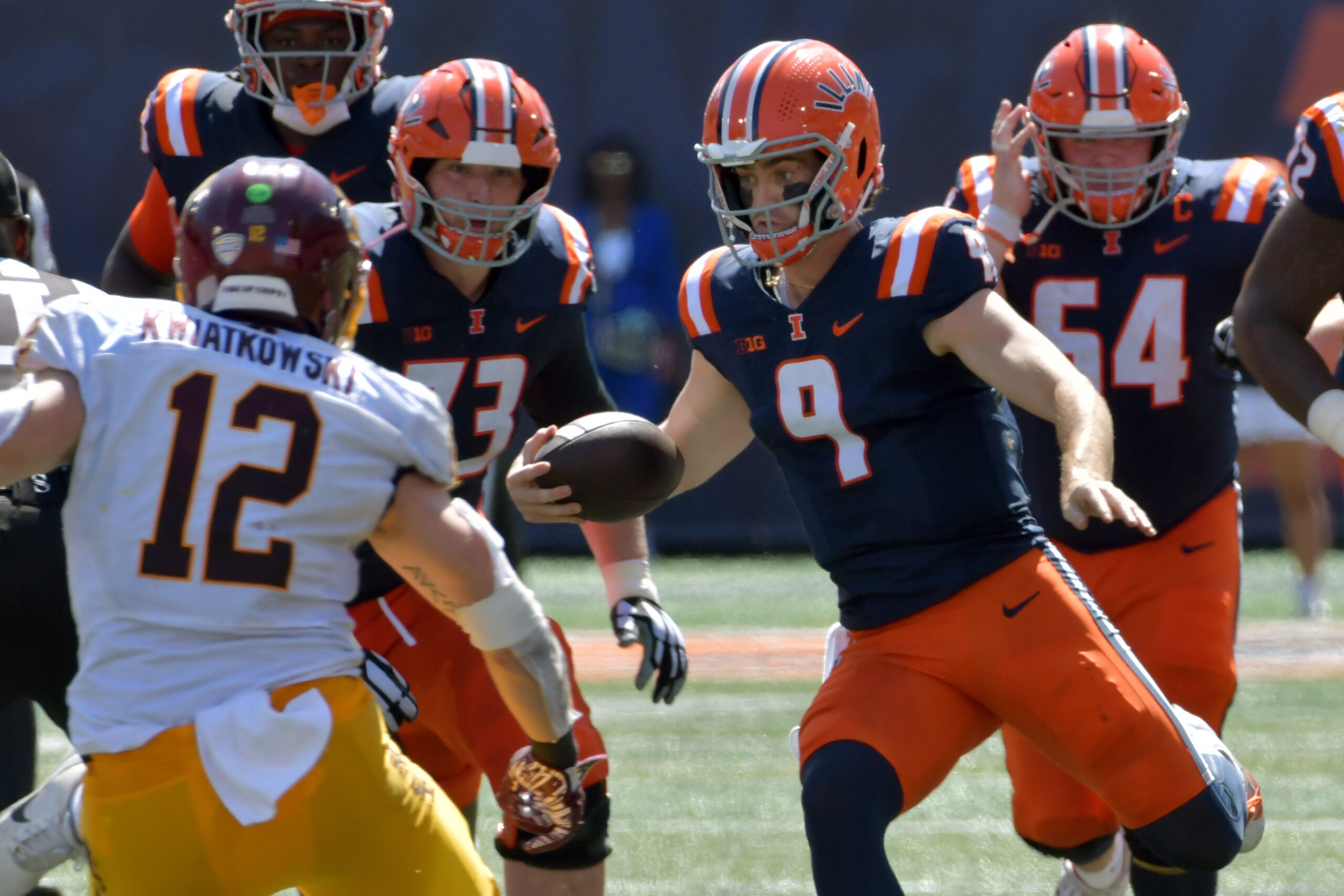 Sep 14, 2024; Champaign, Illinois, USA; Illinois Fighting Illini quarterback Luke Altmyer (9) runs with the ball against the Central Michigan Chippewas during the first half at Memorial Stadium. Mandatory Credit: Ron Johnson-Imagn Images