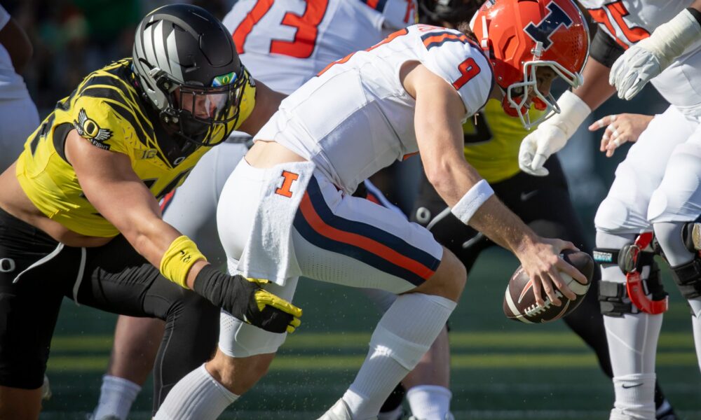 Oregon outside linebacker Teitum Tuioti sacks Illinois quarterback Luke Altmyer as the No. 1 Oregon Ducks host the No. 21 Illinois Fighting Illini Saturday, Oct. 26, 2024 at Autzen Stadium in Eugene, Ore.