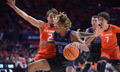 Nov 4, 2024; Champaign, Illinois, USA; Illinois Fighting Illini guard Dra Gibbs-Lawhorn (2) defends Eastern Illinois Panthers guard Zion Fruster (5) during the second half at State Farm Center. Mandatory Credit: Ron Johnson-Imagn Images