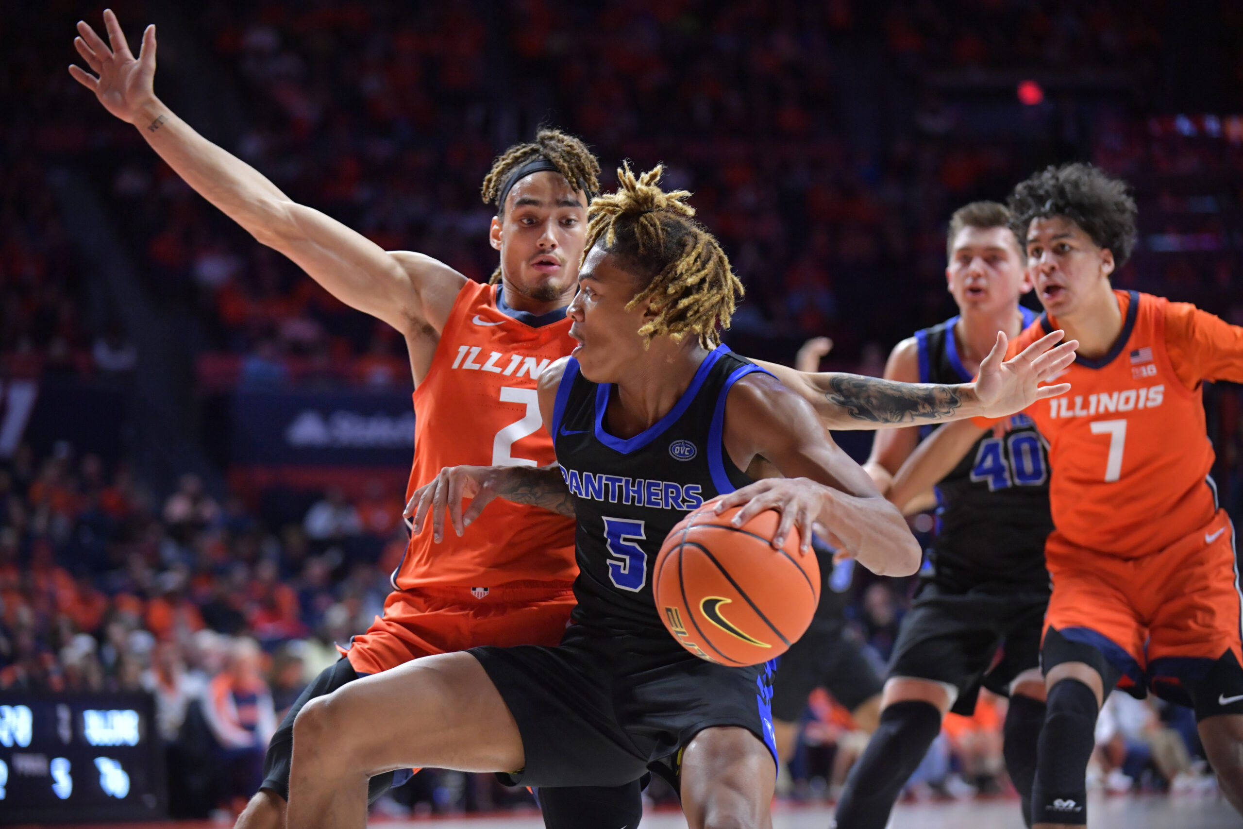 Nov 4, 2024; Champaign, Illinois, USA; Illinois Fighting Illini guard Dra Gibbs-Lawhorn (2) defends Eastern Illinois Panthers guard Zion Fruster (5) during the second half at State Farm Center. Mandatory Credit: Ron Johnson-Imagn Images