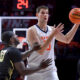 Nov 13, 2024; Champaign, Illinois, USA; Illinois Fighting Illini center Tomislav Ivisic (13) looks to pass against Oakland Golden Grizzlies guard DQ Cole (10) during the first half at State Farm Center. Mandatory Credit: Ron Johnson-Imagn Images