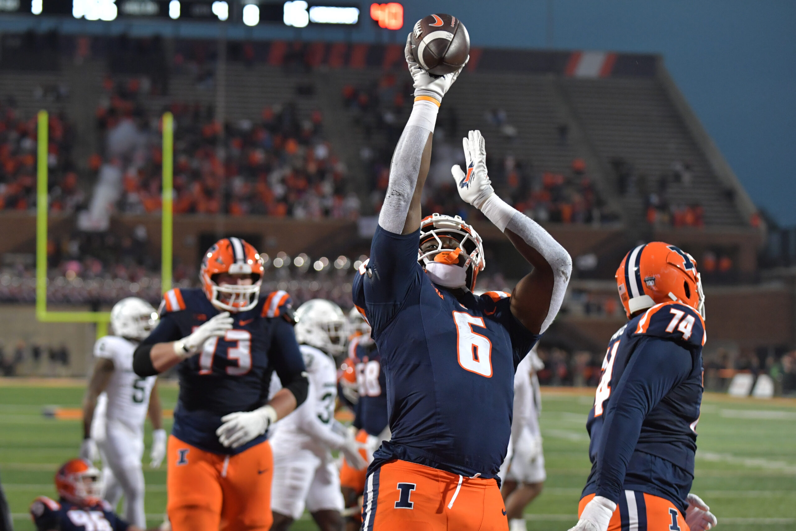 Nov 16, 2024; Champaign, Illinois, USA; Illinois Fighting Illini running back Josh McCray (6) celebrates his touchdown during the second half against the Michigan State Spartans at Memorial Stadium. Mandatory Credit: Ron Johnson-Imagn Images