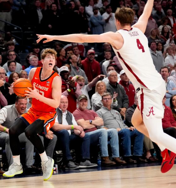 Nov 20, 2024; Birmingham, AL, USA; Illinois guard Kasparas Jakucionis (32) makes a face as he attempts a shot against Alabama forward Grant Nelson (4) in the CM Newton Classic at Legacy Arena. Alabama defeated Illinois 100-87. Mandatory Credit: Gary Cosby Jr.-Tuscaloosa News