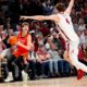 Nov 20, 2024; Birmingham, AL, USA; Illinois guard Kasparas Jakucionis (32) makes a face as he attempts a shot against Alabama forward Grant Nelson (4) in the CM Newton Classic at Legacy Arena. Alabama defeated Illinois 100-87. Mandatory Credit: Gary Cosby Jr.-Tuscaloosa News