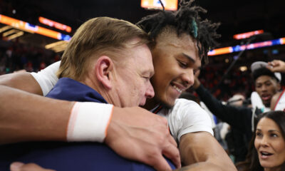 Brad Underwood gives Terrence Shannon Jr. an embrace.