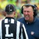 Bret Bielema has a discussion with a referee.