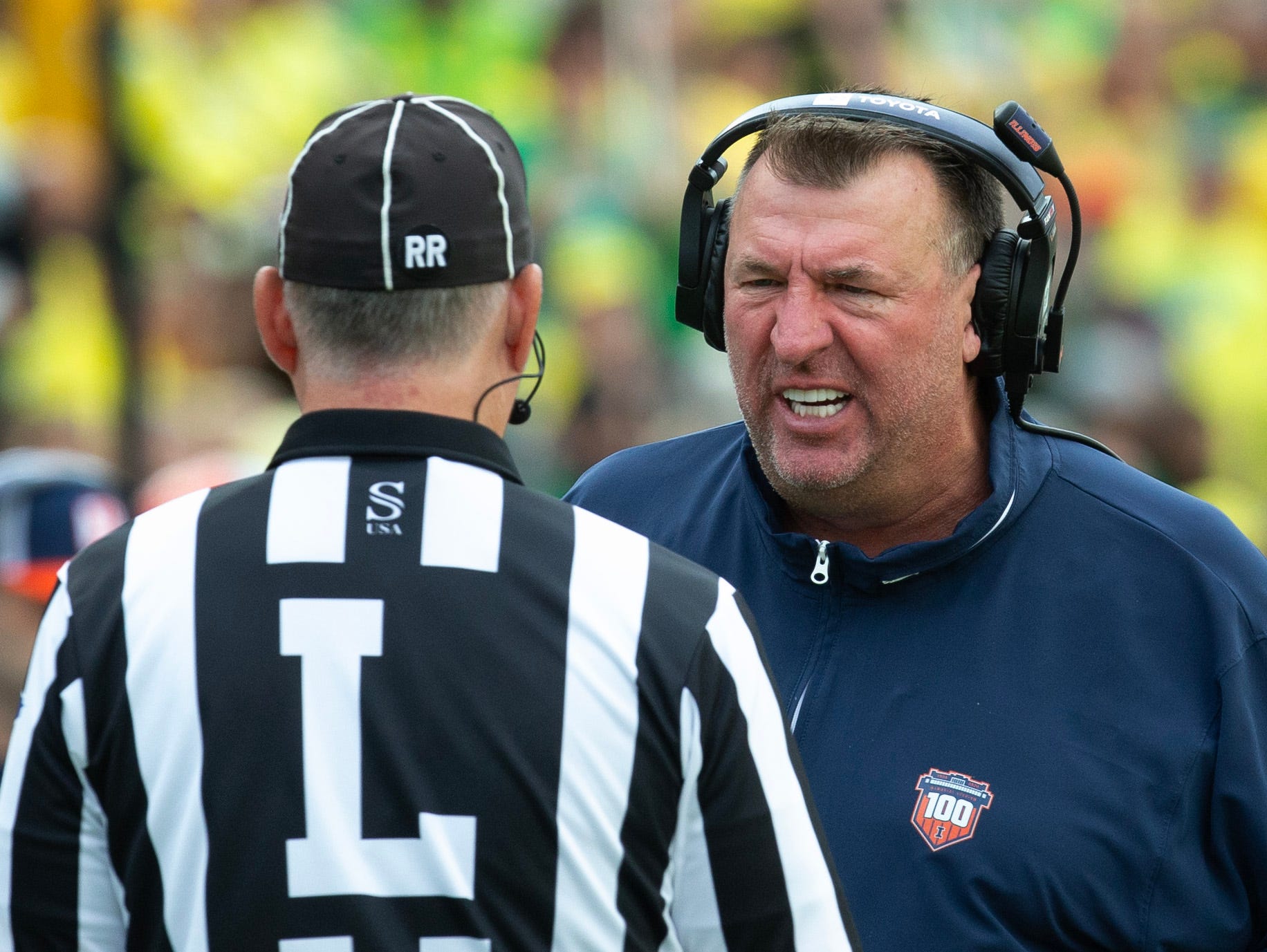 Bret Bielema has a discussion with a referee.