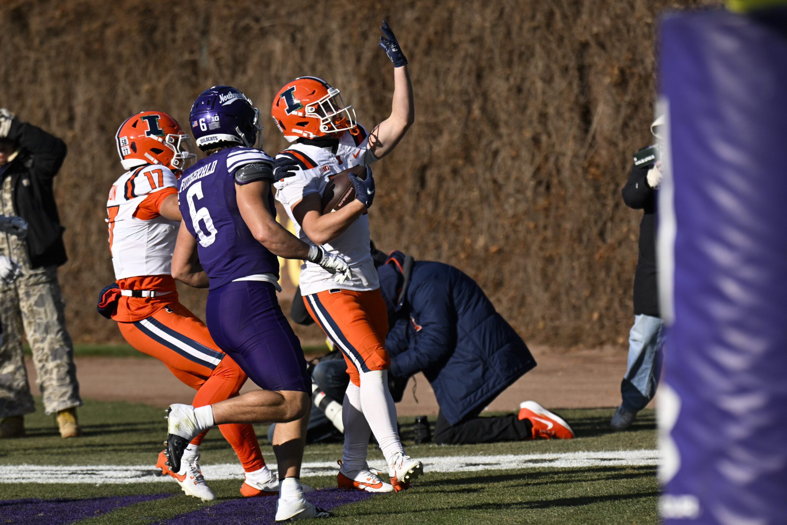 Nov 30, 2024; Chicago, Illinois, USA; Illinois Fighting Illini running back Aidan Laughery (21) scores a touchdown against the Northwestern Wildcats during the second half at Wrigley Field. Mandatory Credit: Matt Marton-Imagn Images