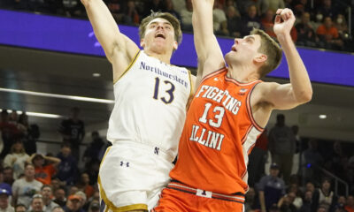 Dec 6, 2024; Evanston, Illinois, USA; Illinois Fighting Illini center Tomislav Ivisic (13) defends Northwestern Wildcats guard Brooks Barnhizer (13) during the second half at Welsh-Ryan Arena. Mandatory Credit: David Banks-Imagn Images