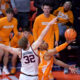 Dec 14, 2024; Champaign, Illinois, USA; Tennessee Volunteers guard Jordan Gainey (11) drives to the basket and scores as Illinois Fighting Illini guard Kasparas Jakucionis (32) defends in the final seconds at State Farm Center. Mandatory Credit: Ron Johnson-Imagn Images