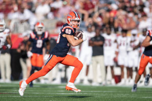 Dec 31, 2024; Orlando, FL, USA; Illinois Fighting Illini wide receiver Hank Beatty (80) runs the ball after the catch against the South Carolina Gamecocks in the first quarter at Camping World Stadium. Mandatory Credit: Jeremy Reper-Imagn Images