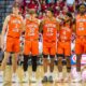 Illinois basketball players standing together vs Indiana.