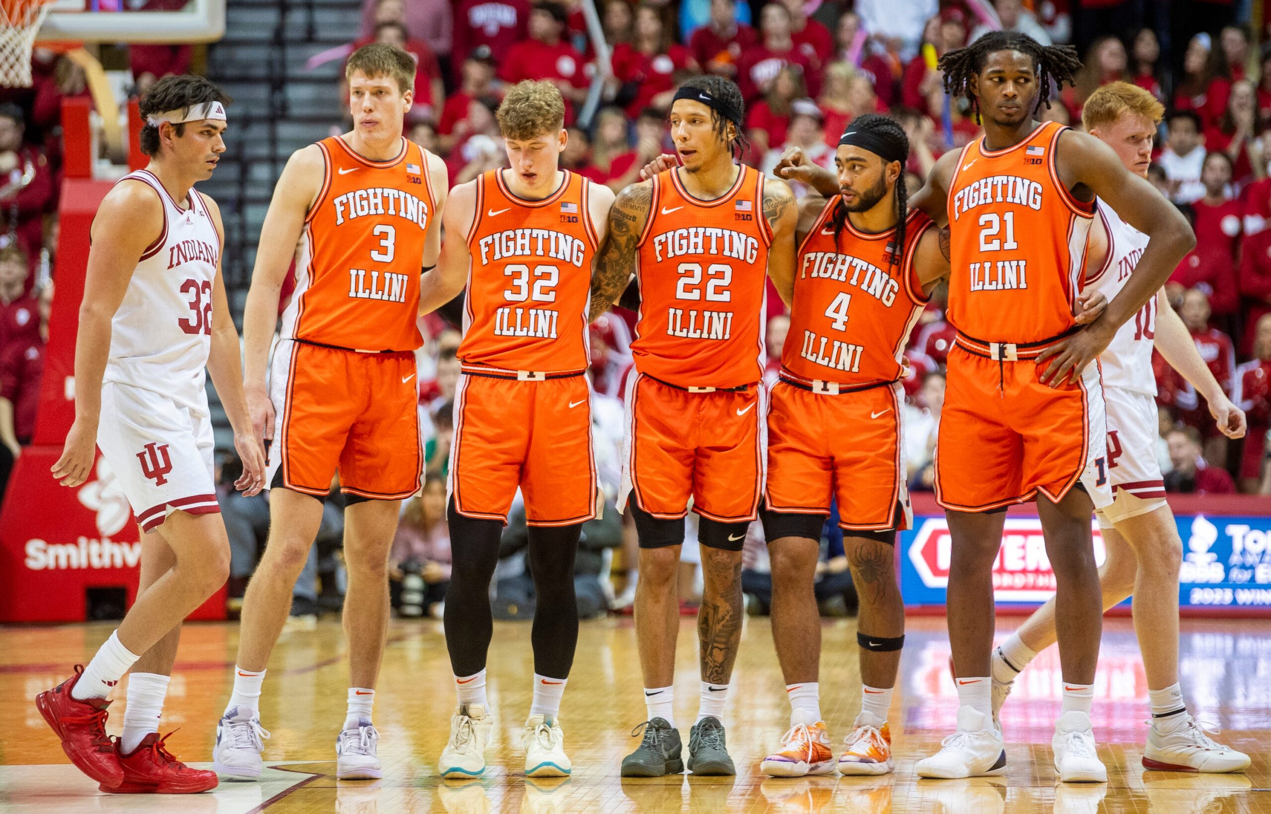 Illinois basketball players standing together vs Indiana.