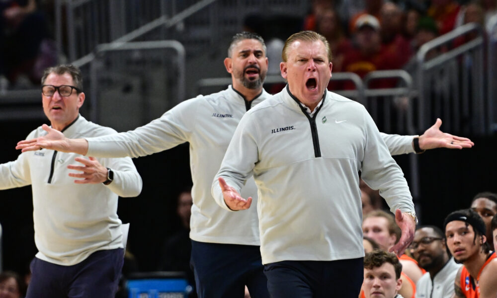Illinois basketball coaching staff questions a call.