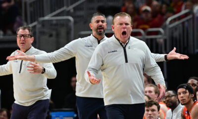 Illinois basketball coaching staff questions a call.