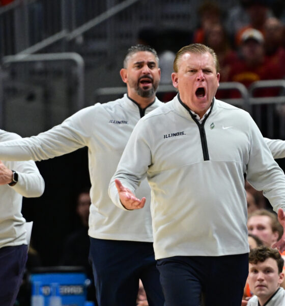 Illinois basketball coaching staff questions a call.