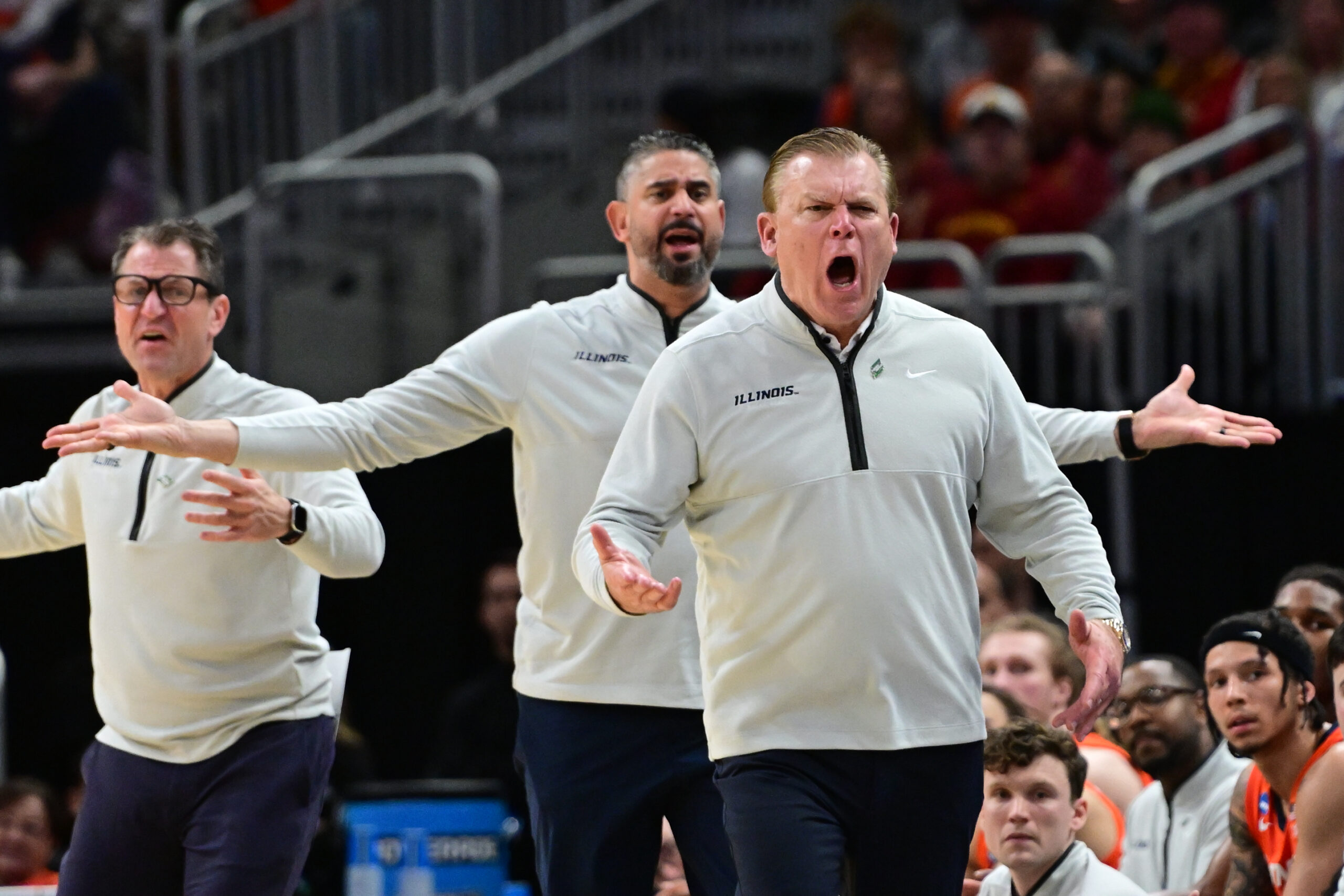 Illinois basketball coaching staff questions a call.