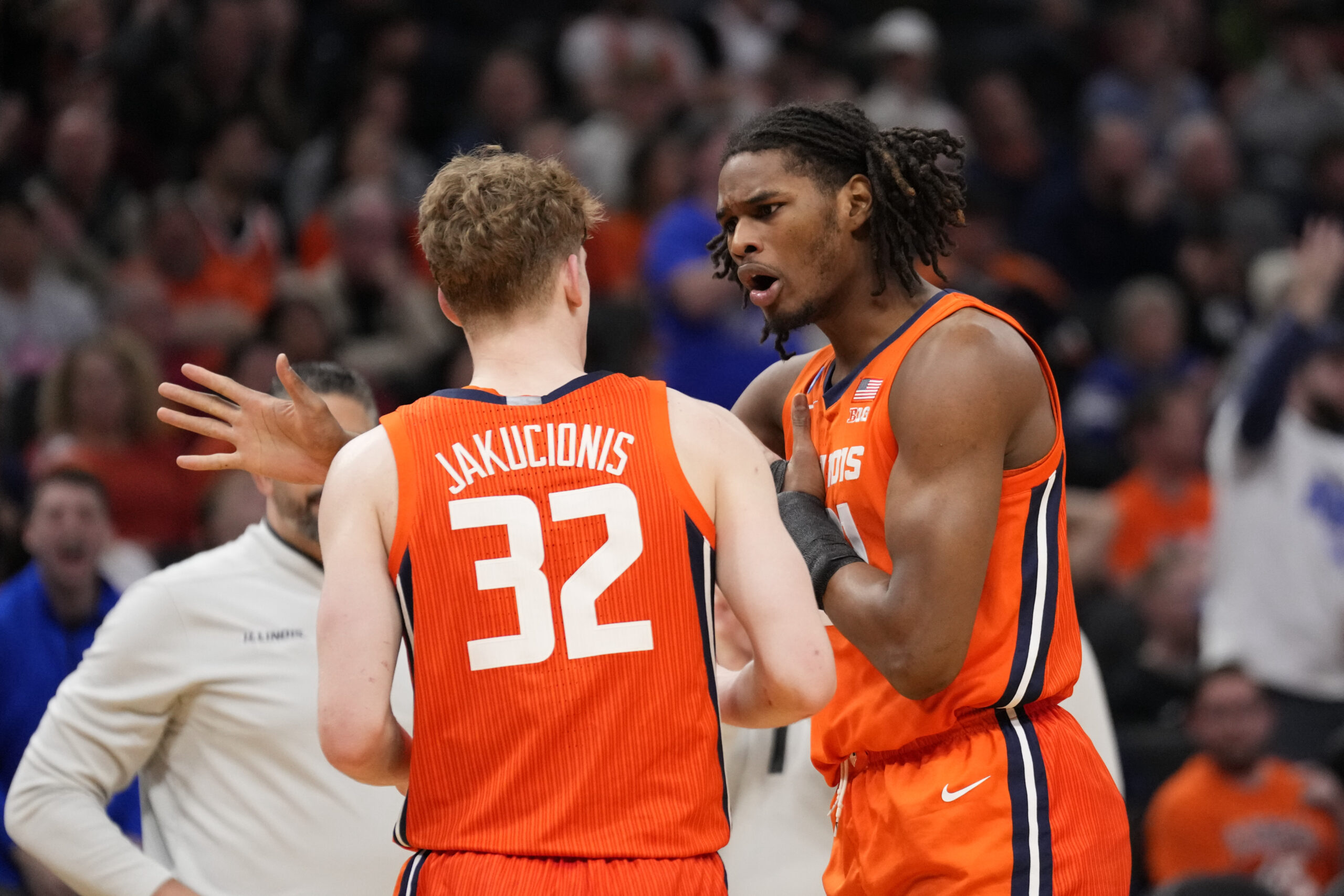 Illini basketball guard, Kasparas Jakucionis talks with Morez Johnson Jr.