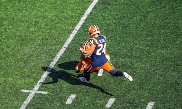 illinois football kicker David Olano kicks a field goal.