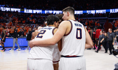 Illinois basketball forwards David Mirkovic and Andrej Stojakovic huddled up.