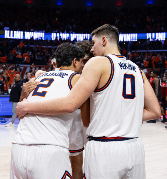 Illinois basketball forwards David Mirkovic and Andrej Stojakovic huddled up.
