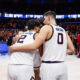 Illinois basketball forwards David Mirkovic and Andrej Stojakovic huddled up.