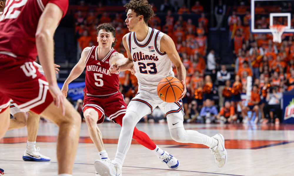 Keaton Wagler dribbling past Indiana's Connor Enright.