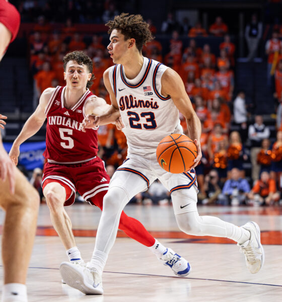 Keaton Wagler dribbling past Indiana's Connor Enright.