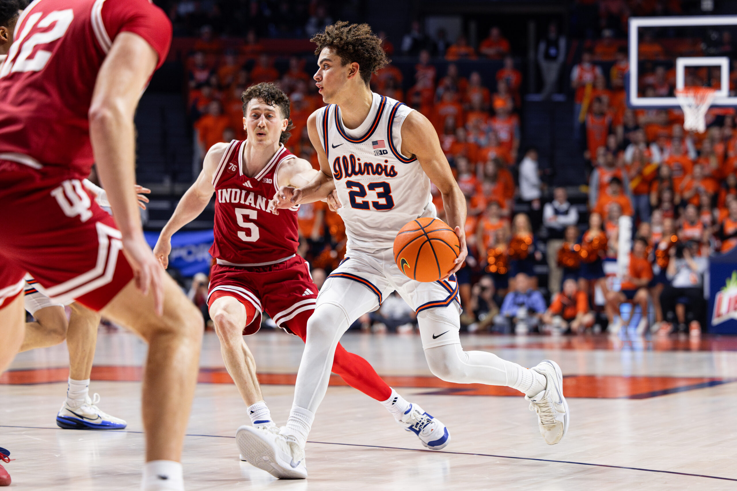 Keaton Wagler dribbling past Indiana's Connor Enright.