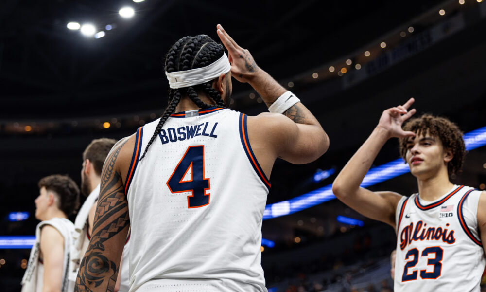 Illinois basketball guard Kylan Boswell and Keaton Wagler celebrating at the 2025 Braggin' Rights game.