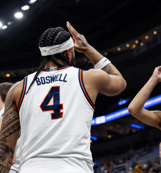Illinois basketball guard Kylan Boswell and Keaton Wagler celebrating at the 2025 Braggin' Rights game.