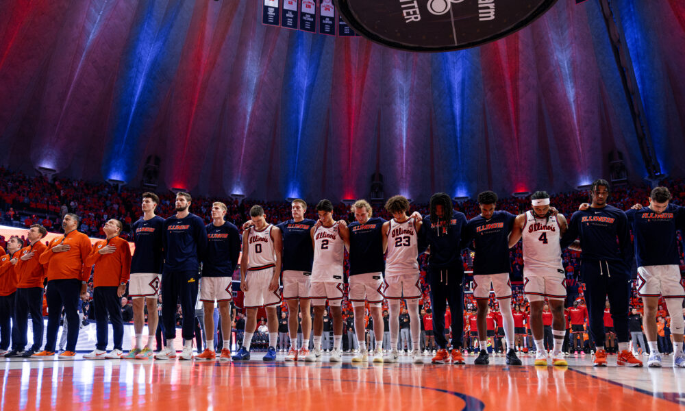 The Illinois basketball team standing front and center before the National Anthem.