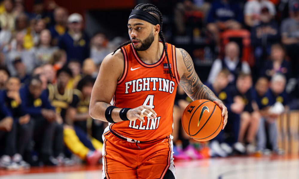 Illini guard Kylan Boswell dribbling the ball vs Michigan.
