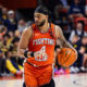 Illini guard Kylan Boswell dribbling the ball vs Michigan.