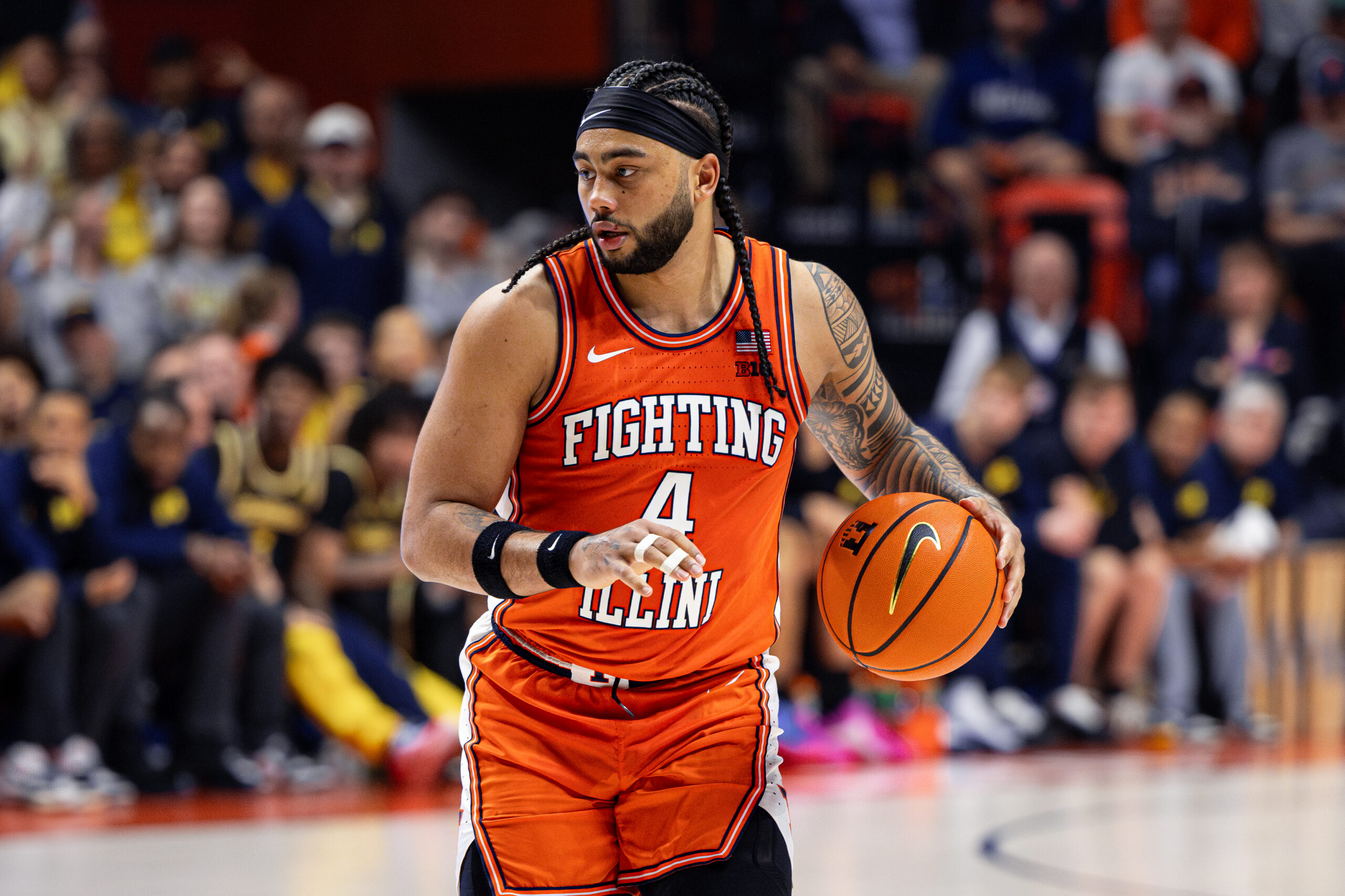 Illini guard Kylan Boswell dribbling the ball vs Michigan.