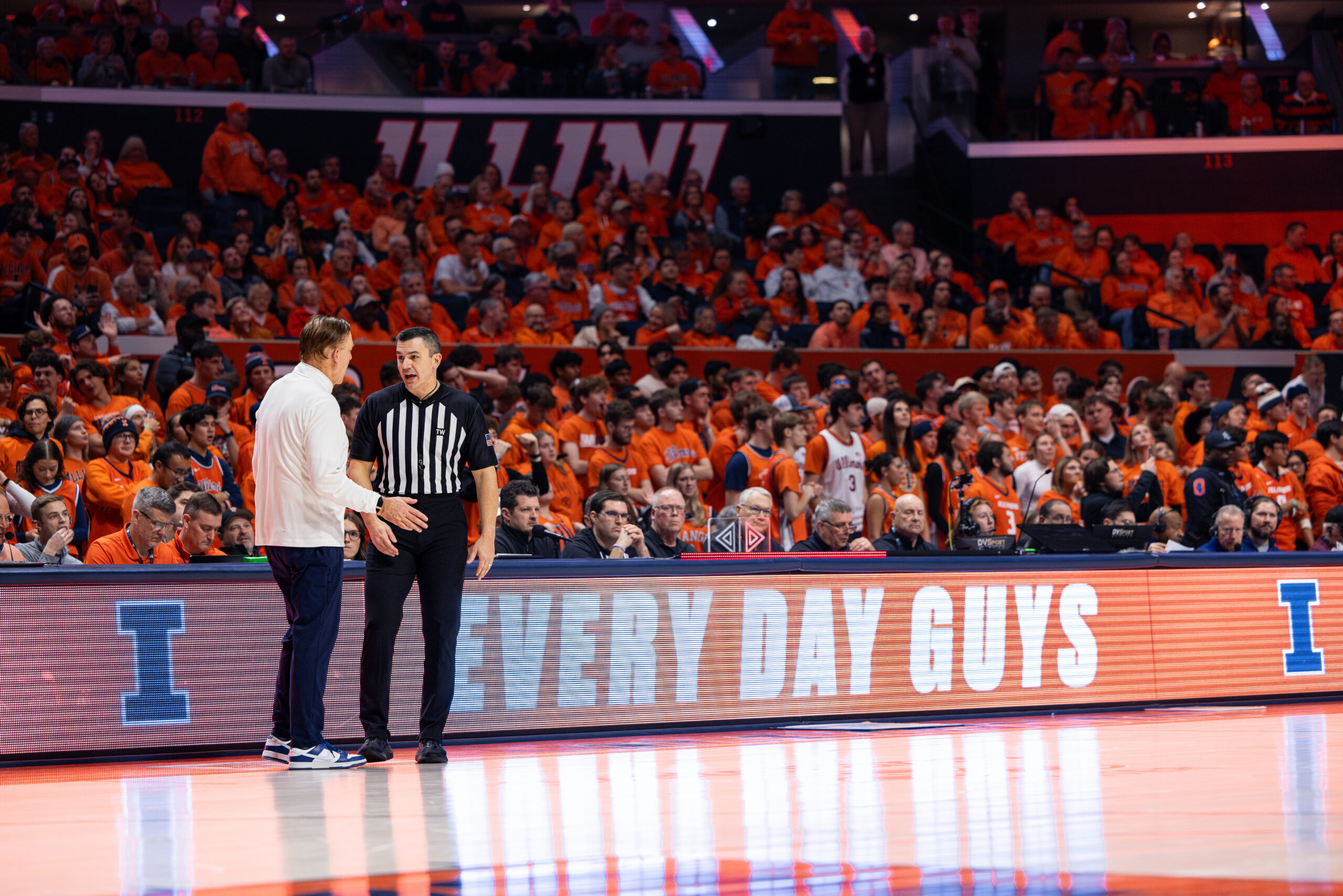 Illinois basketball coach Brad Underwood talks to the referee at State Farm Center