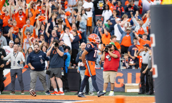 Illinois Football star Collin Dixon celebrates a late fourth quarter touchdown.